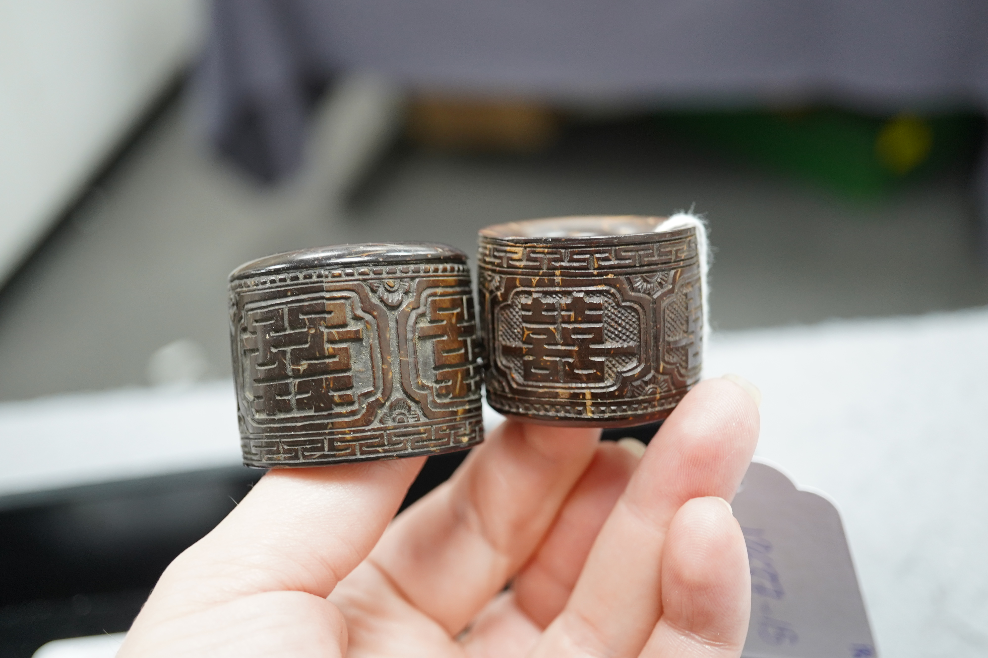 A pair of rare Chinese Straits palm wood archer's thumb rings, 19th century